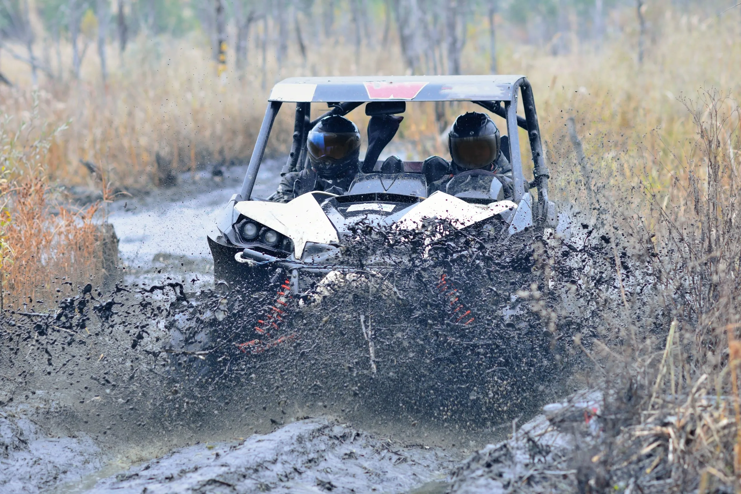 Amazing UTV driving in mud and water at Autumn day